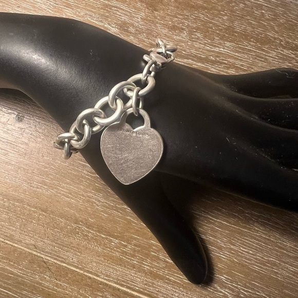 Tiffany and Co. 8” Sterling Silver Bracelet with a 1” Charm. - Picture 1 of 11